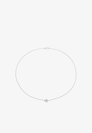 Srebrny naszyjnik z cienkim łańcuszkiem, z prostym, okrągłym wisiorkiem w kształcie węzła na środku. Gładka tekstura, minimalistyczny design.