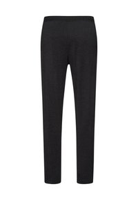 Zwarte legging van zachte stof, met een rekbare tailleband, slim fit en zonder zichtbare patronen of versieringen.