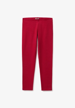 Rote Leggings in voller Länge mit schlanker Passform und kleinem Logo nahe dem unteren Saum an einem Bein.
