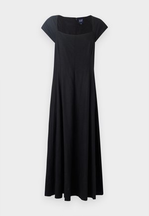 Musta hihaton mekko, jossa on istuva bodice, levenevä hame ja neliönmuotoinen pääntie. Kangas vaikuttaa sileältä, ja takana on vetoketjusulku.