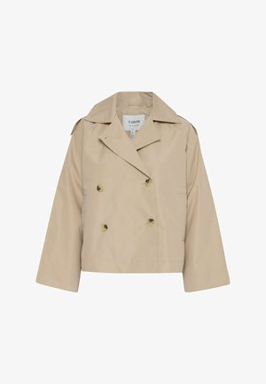 Bežs divrindas uzvalks ar lieliem zelta pogām, platām atloks, īsā dizainā un gludu tekstūru. Redzamu kabatu nav.