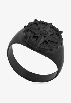 Bague en métal noir dotée d'un design de boussole en relief, avec des détails complexes et une finition mate lisse sur le band.