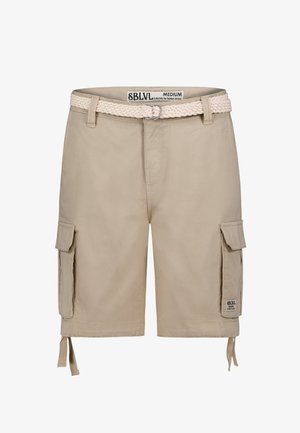 Beige cargo shorts featuring a braided white belt, side pockets, drawstrings at the hem, and a small brand label on the leg.