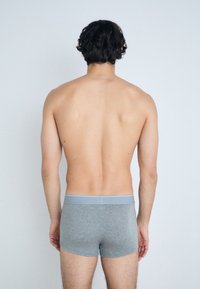 Gray boxer briefs with a light blue waistband. The fabric appears soft with a smooth texture. View from the back, showcasing a fitted design.