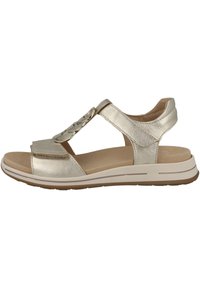 Metallic gold sandal with a T-strap design, textured upper, adjustable strap, padded insole, and rubber sole with light traction.