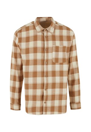 Brūna un krēmkrāsas ķīļveida flaneļa krekls ar garām piedurknēm, pogu aizdari un vienu krūšu kabatu. Mīksta tekstūra, apkakles dizains.