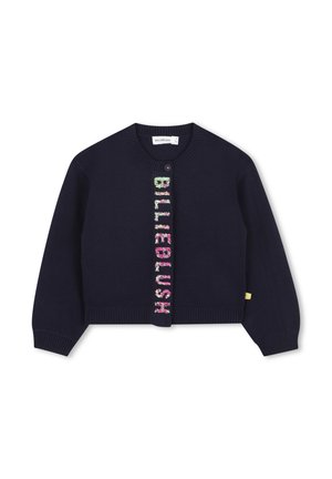 Cardigan per bambini di colore blu navy con maniche lunghe, polsini e orlo a coste, un singolo bottone sulla parte superiore e "BILLIEBLUSH" in paillettes multicolori disposte verticalmente sul davanti.