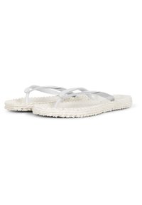 White flip-flops with clear straps and woven textured soles, featuring a rounded shape and minimalistic design.