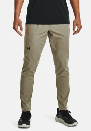 Leichte khakifarbene Sporthose mit schlank zulaufendem Design aus glattem Stoff. Merkmale sind dezente Nähte und ein schwarzes Logo am linken Oberschenkel.