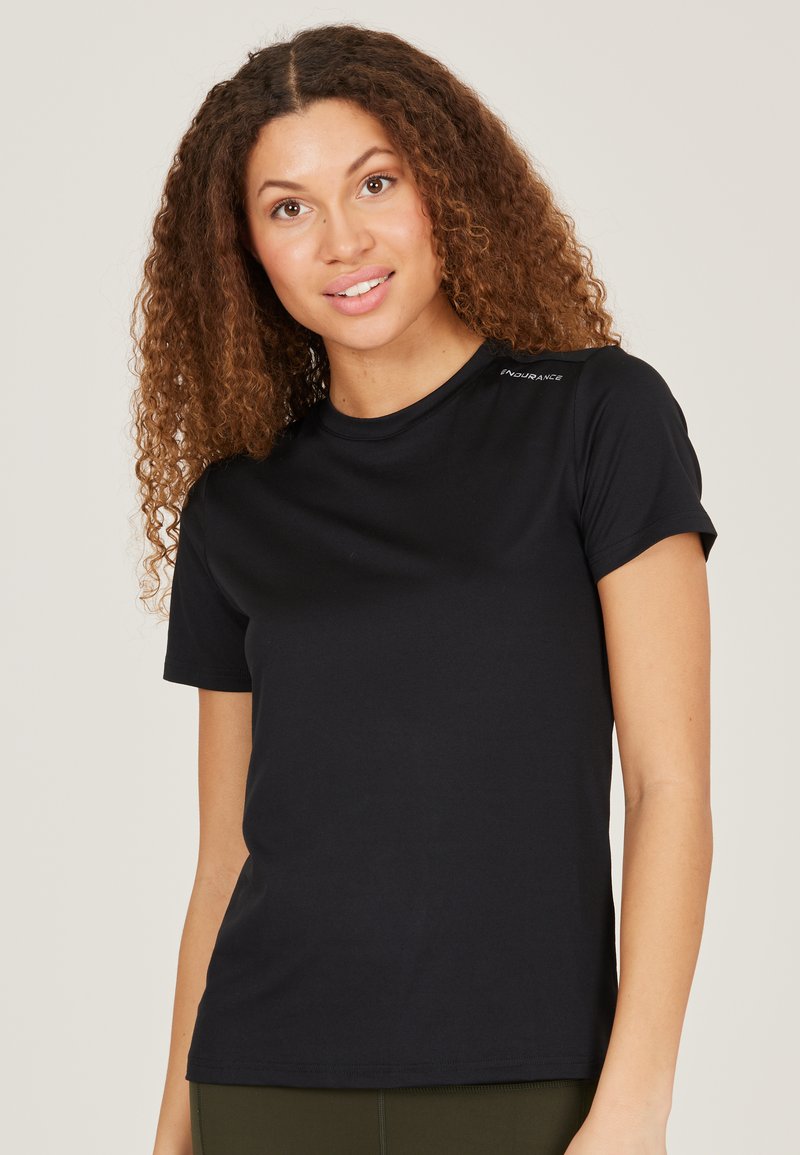 Black short-sleeve T-shirt made of soft fabric, featuring a round neckline and subtle logo accent on the shoulder. Smooth texture.