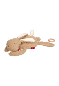 Soft plush rabbit in light brown with white ears and a red label. Features a textured fabric and an attached wooden ring.