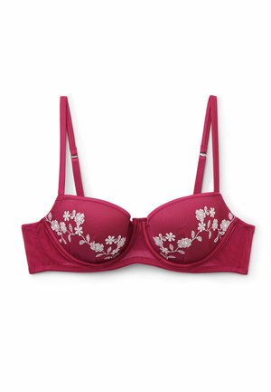 Sujetador con aro rojo con tirantes ajustables y bordado floral blanco en las copas, colocado plano sobre un fondo blanco.
