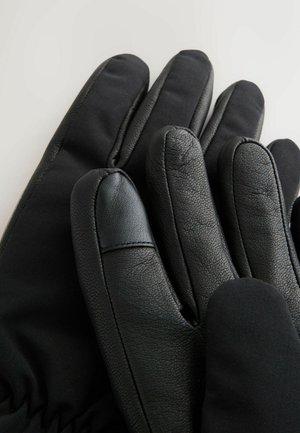 Mustad kindad, mis on valmistatud nahast ja pehmest, venivast materjalist. Disainis on sõrmed, millel on eraldatud osad ja siledad tekstuurid.