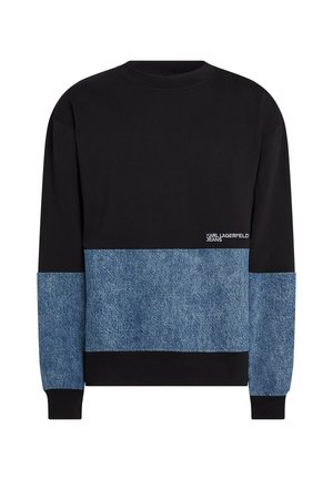 Schwarzer Sweatshirt mit einem unteren Abschnitt in Denimblau. Klassischer Rundhalsausschnitt, lange Ärmel und weiße Logodetails auf der Vorderseite.