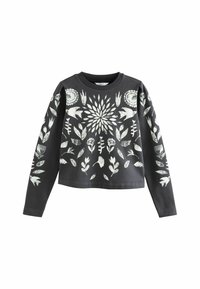 Mørkegrå langærmet cropped sweatshirt med hvide botaniske og fugletryk arrangeret i et symmetrisk mønster på fronten og ærmerne.