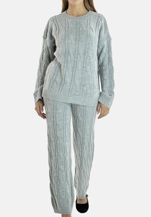 Gray knitted sweater and pants set featuring a cable knit pattern, ribbed cuffs, and a relaxed fit. The fabric appears soft and textured.