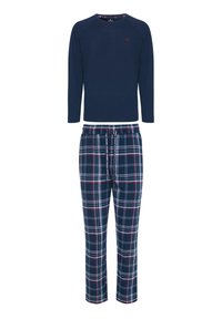 Musta pitkähiha paita pyöreällä kaula-aukolla ja pienellä logolla; ruudulliset pyjamahousut tummansinisinä, valkoisina ja punaisina, joustavalla vyötäröllä ja nauhalla.