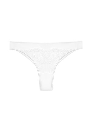 String en dentelle blanche avec broderie florale sur la ceinture devant, posé à plat sur un fond blanc.
