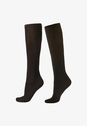 Calcetas marrones hasta la rodilla, hechas de un material suave y elástico. Tienen una textura lisa y una parte superior acanalada para un ajuste seguro.