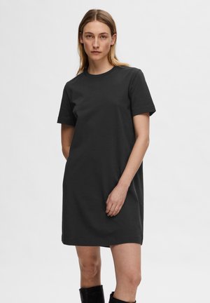 Black t-shirt dress made of cotton, featuring a crew neckline and short sleeves, with a relaxed fit and a smooth texture.