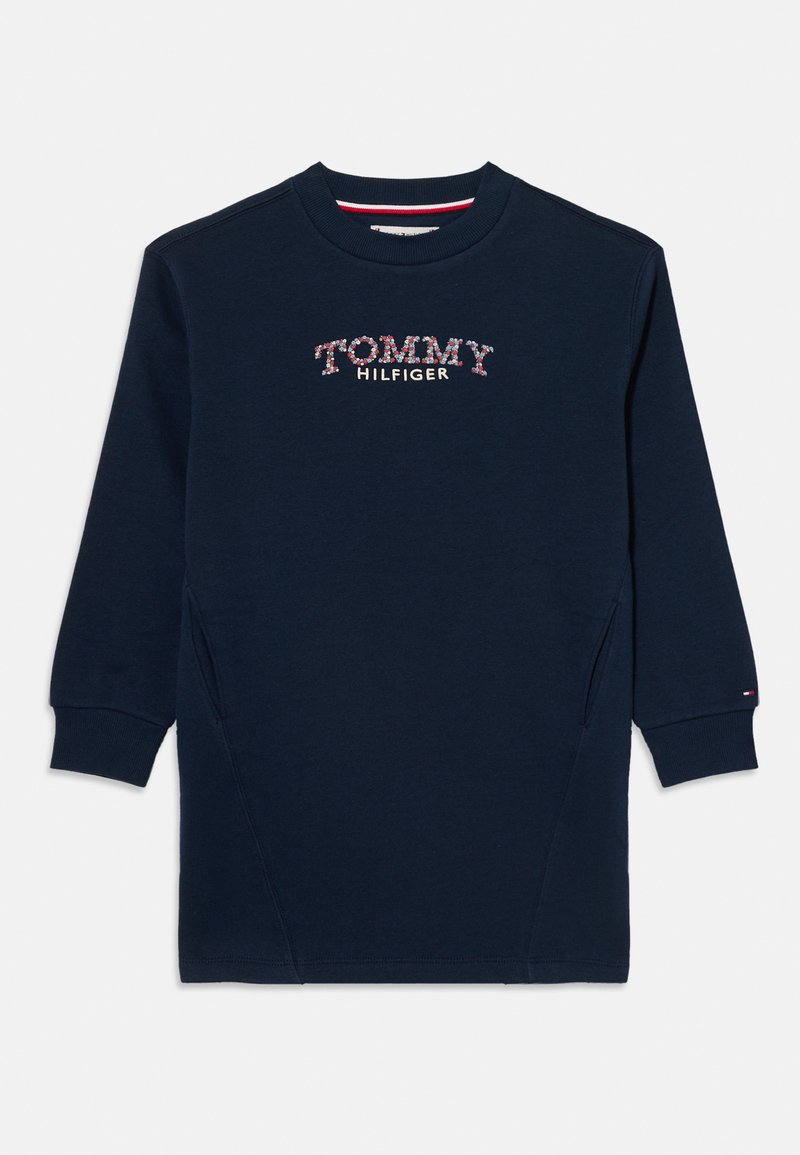 Tengerészkék pulóverruha "TOMMY HILFIGER" virágos hímzéssel. Kerek nyakkal, hosszú ujjakkal és oldalsó zsebekkel rendelkezik.