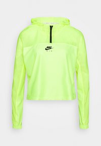 Veste coupe-vent à capuche légère, verte fluo, avec une fermeture éclair quart, texture en maille et logo Nike Air noir sur la poitrine. Manches longues.