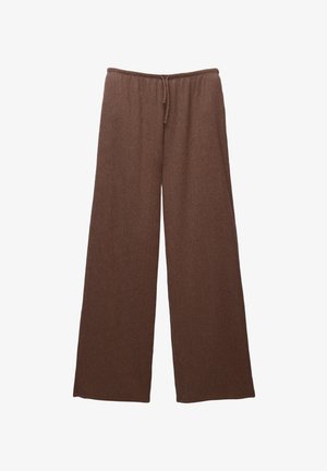 Rjave široke hlače z elastičnim pasom in vrvico, izdelane iz rebraste tkanine. Brez žepov ali opreme.