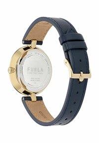 Mornarska kožna narukvica s satom u zlatu od nehrđajućeg čelika, okruglo lice i glatka stražnja strana. Sadrži metalnu kopču i označen je s "Furla."