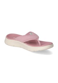 Sandale en plastique rose avec une bride texturée, semelle plate et matelassage. L'empeigne présente un design à bandes croisées et une semelle intérieure lisse pour plus de confort.