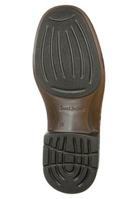 Suela de zapato de goma negra con patrón de agarre texturizado, que presenta líneas de indentación y la marca "Josef Seibel" junto con el tamaño "41".