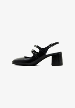 Chaussure noire en cuir style Mary Jane avec deux brides à boucle, bride arrière, bout arrondi et talon bloc.