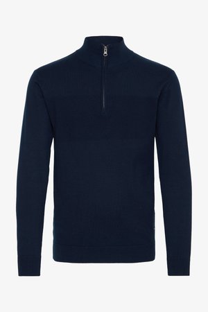 Suéter navy de media cremallera hecho de tela de punto. Presenta puños y dobladillo de canalé, un patrón texturizado en el pecho y una cremallera metálica.