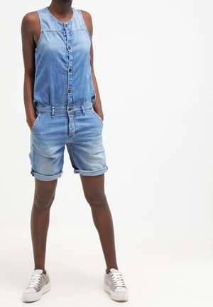 Denim-Shortoverall mit ärmellosem Design, vorderem Knopfverschluss und zwei seitlichen Taschen. Hellblaue Farbe mit ausgebleichten Akzenten.