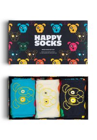 Mixed honden cadeau set van Happy Socks, bevat drie paar crew sokken: blauw met hondenontwerp, crèmekleurig met geel en zwart met gele accenten.