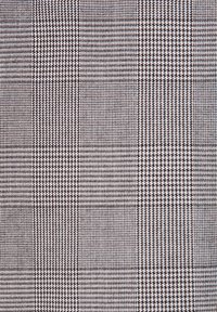 Tkanina z wzorem w kratkę w kolorze czarnym i białym, z różnymi rozmiarami kwadratów. Materiał ma plecioną teksturę.
