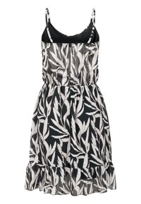 Robe d'été noire et blanche sans manches à motif feuilles, bretelles réglables, taille élastique et ourlet à volants.
