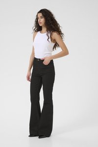 Black flared jeans with a high waist and front pockets, paired with a fitted white tank top. Smooth fabric and tailored fit.