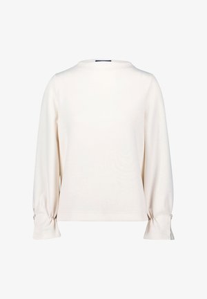 Cream long-sleeve top with a round neckline, gathered cuffs, fitted design, and smooth texture. Subtle sheen on fabric.