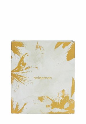 Hardcover boek met een bloemenontwerp in geel en wit. De tekst "heideman" is in goud gedrukt op de voorkant. Textuurafwerking.
