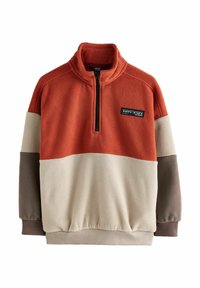 Colour-block fleece pullover with rust orange, beige, and brown panels, zip collar, cuffed sleeves, and a patch with coordinates on chest.