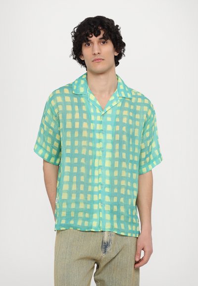 Short-sleeve button-up shirt in lightweight, sheer fabric. Features a checkered pattern in green and pale yellow tones. Soft texture.