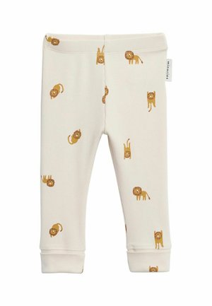 Legginsy dla niemowląt w kolorze kremowym z żółtymi nadrukami zabawnych lwów na całej powierzchni oraz małą materiałową metką marki z boku.