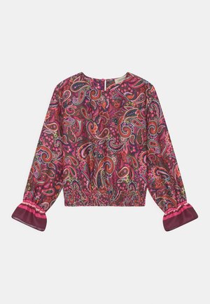 Blouse à manches longues avec motif cachemire multicolore, taille élastique et poignets à volants dans des tons de rose, rouge, violet et vert.