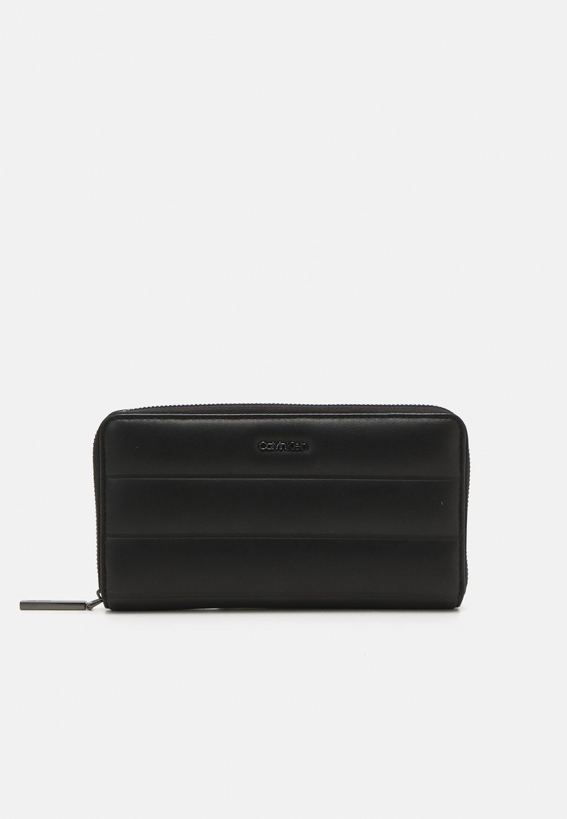 Calvin Klein LINE QUILT LARGE ZIP AROUND - Wallet - black