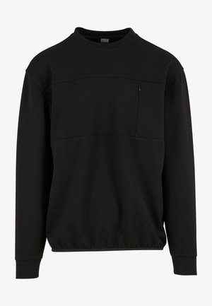 Crna dukserica od mekog materijala s okruglim izrezom, dugim rukavima, elastičnom strukom i malim dvostrukim džepom na prsima.