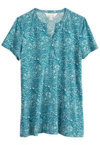 Kortärmad, tealfärgad T-shirt med V-urtavla som har ett vitt abstrakt mönster som liknar vågor och blommönster, tillverkad av ett mjukt och andningsbart material.