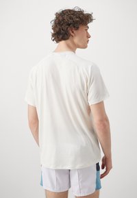 ASICS GAME  - Basic T-shirt - cream