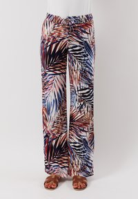 Pantaloni a gamba larga in tessuto leggero con una stampa multicolore di foglie tropicali in tonalità rosse, blu e crema. Vita elasticizzata con cordoncino.