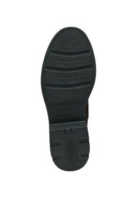Semelle de chaussure en caoutchouc noir avec une surface texturée dotée de perforations circulaires et de motifs en relief, portant la marque "GEOX" au centre.