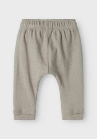 Helle graue Kinderhose aus strukturiertem Stoff, mit einem elastischen Bund und eng anliegenden Bündchen am Knöchel.